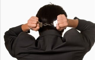 Man in Handcuffs Due to Restraining Order False Accusations